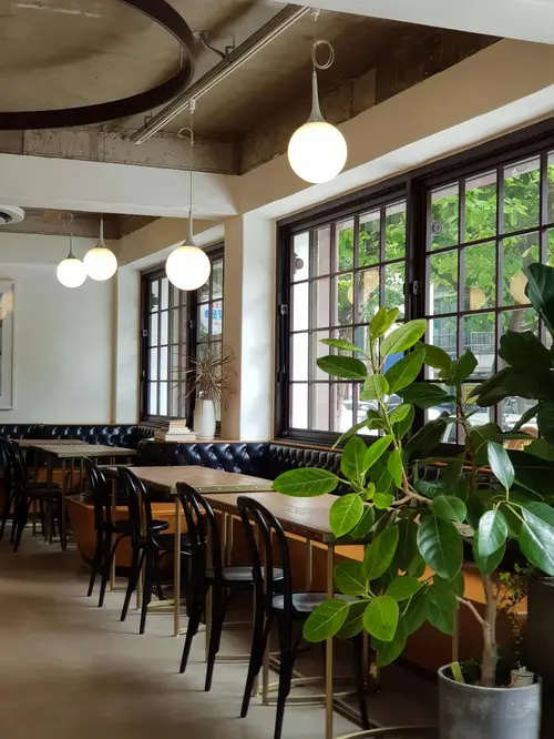 Wooden tables and chairs in a bright room