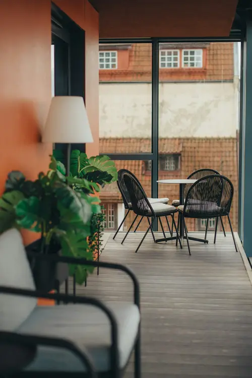 Balcony with a small table and plants